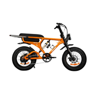 An orange and black Fatfish Grime electric fat-tire bike with a rear cargo platform, front headlight, and suspension, shown from a side profile on a white background.