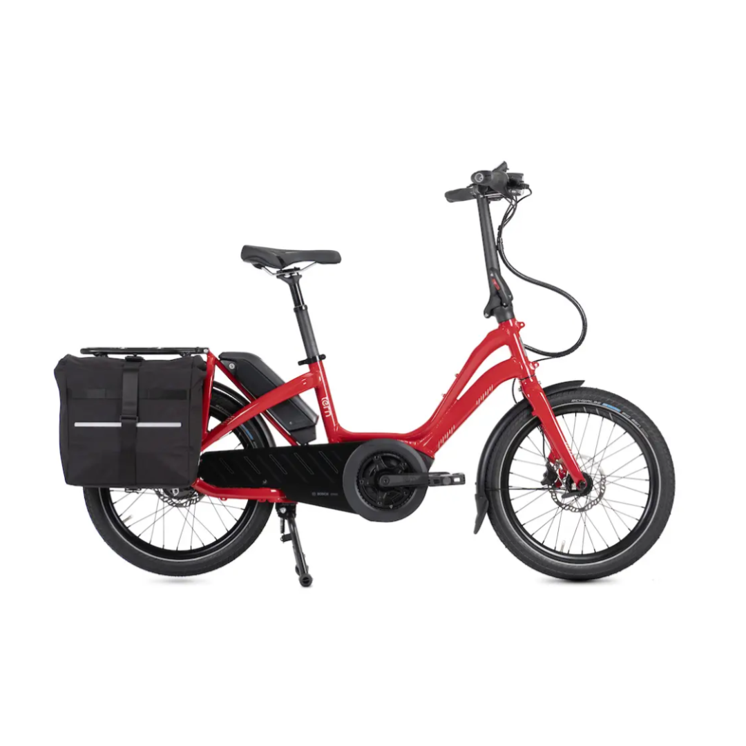 A red step-through Tern NBD electric cargo bicycle with black components, a rear black pannier bag, and a front suspension fork, shown against a plain white background.